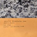 Orange business card on granite surface showing contact details for Frosty Mountain Dew including social media handle, registration number and website