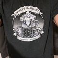 Person wearing a dark sweatshirt with a gardening-themed graphic design featuring watering cans and plants with text about gardening